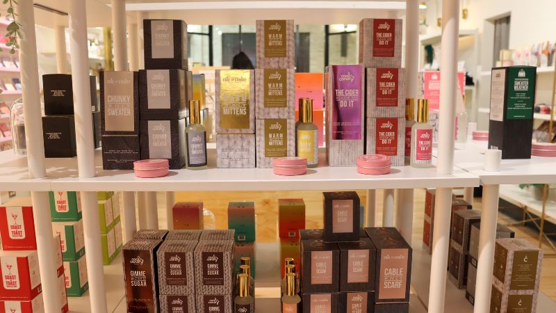 Shelf full of candles and room sprays at Coal and Canary.